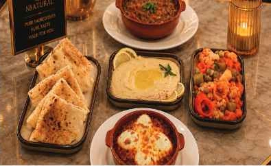 TAM breakfast spread with bread, eggs and beans